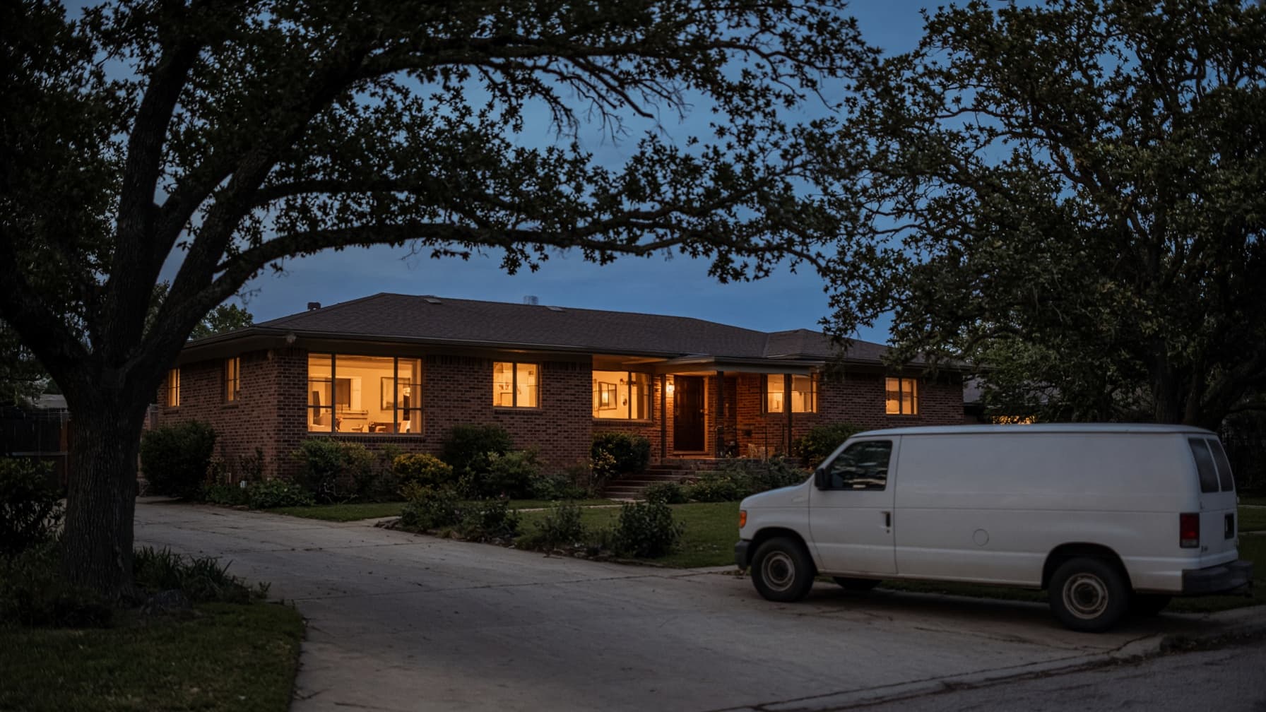 A warmly lit North Texas home at dusk.